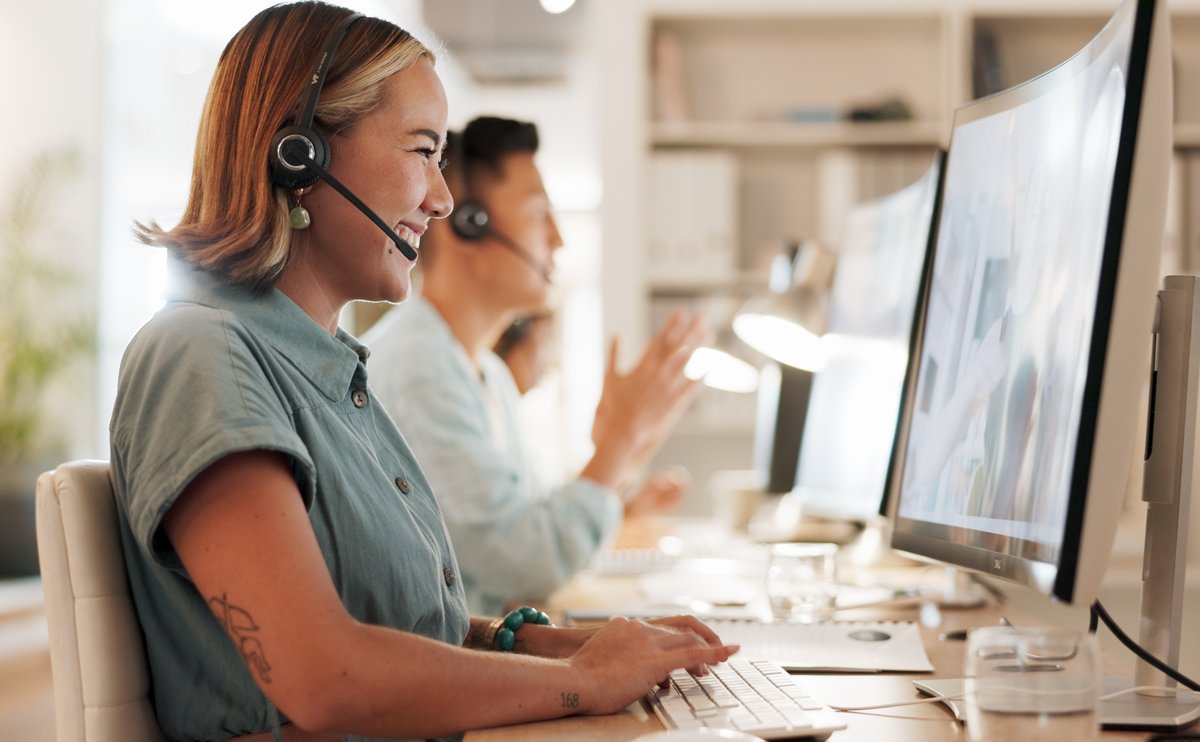 Benefits specialist with a headset providing benefits management support