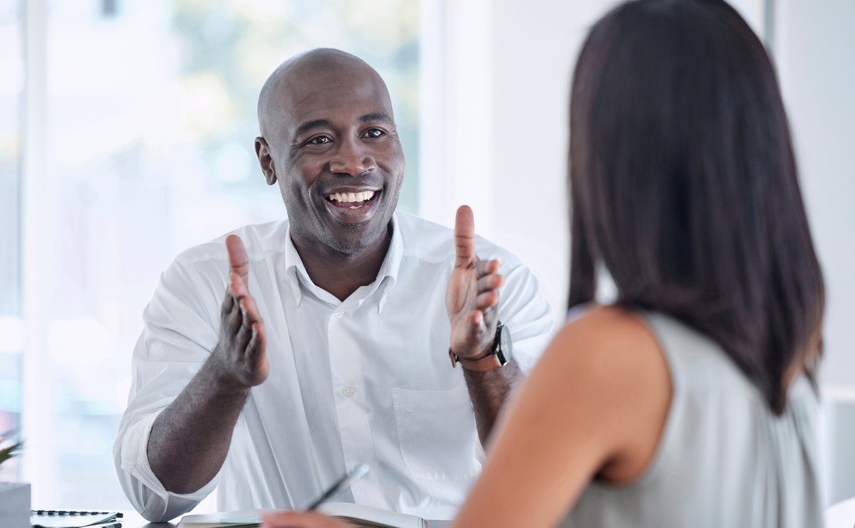 Client giving a thumbs up during an HR administration services consultation